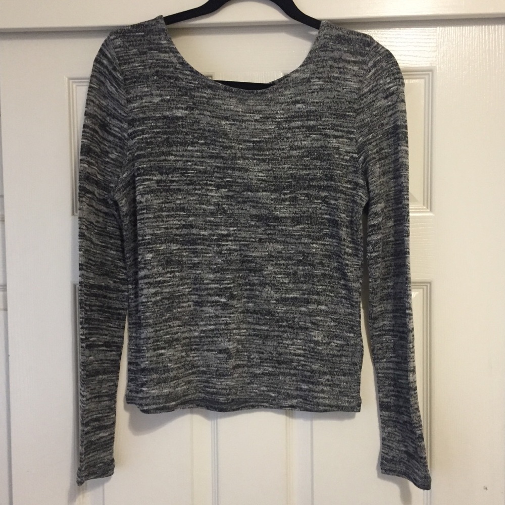 Fitted sweater with strappy detail on the back